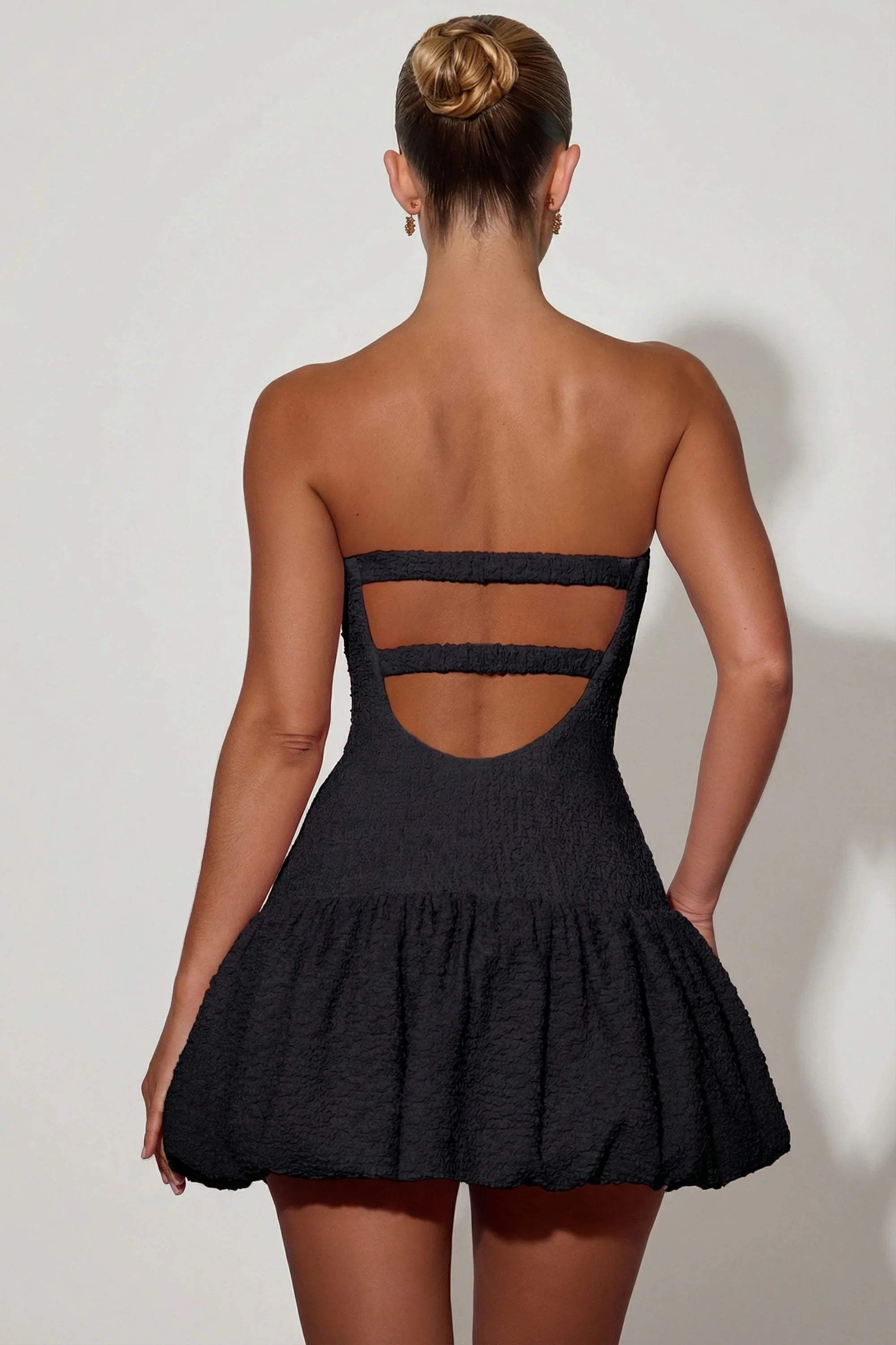 Cut-Out Bubble Hem Corset Mini Dress in Black