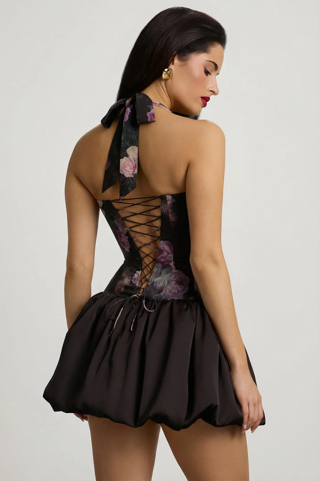 Halterneck Lace-Up Bubble Hem Mini Dress in Black Floral Print